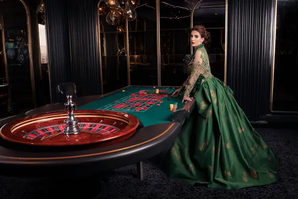 A glamorous woman holding casino chips in a neon-lit environment, representing the premium online casino atmosphere of KM787.