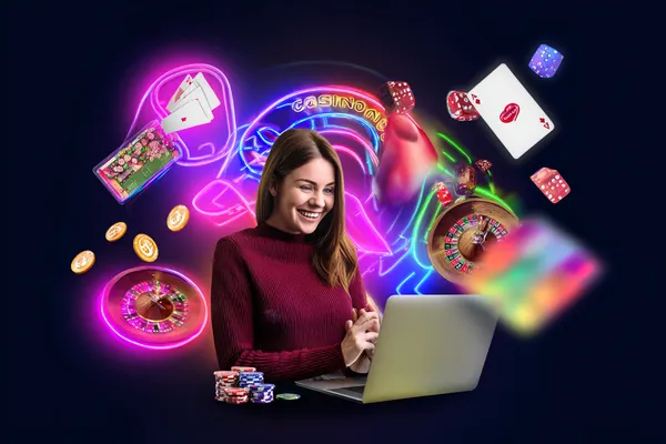 A man celebrating a winning moment on his laptop while gaming symbols float around him, capturing the excitement of KM787 games.