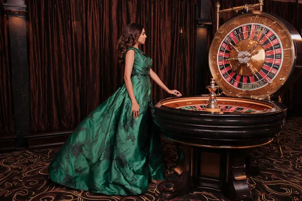 A confident dealer surrounded by casino chips inviting players to access their KM787 account, reflecting quick and easy login options.